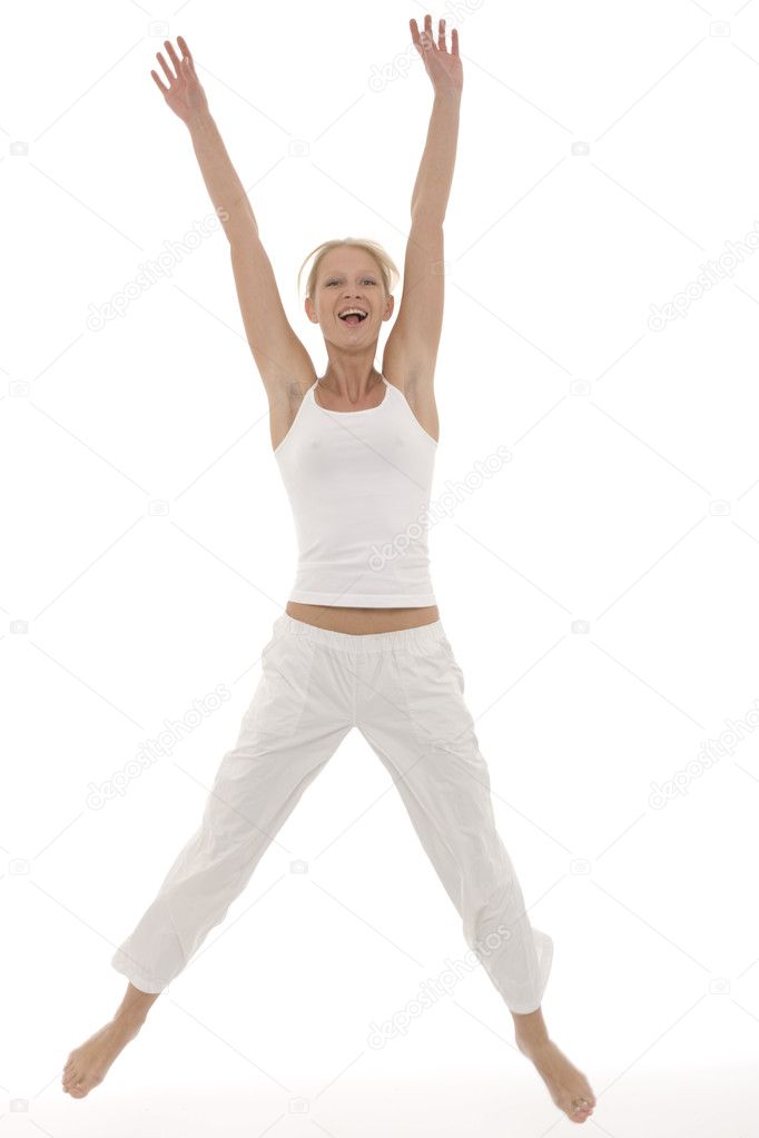 Young beautyful caucasian woman in sportswear jumping