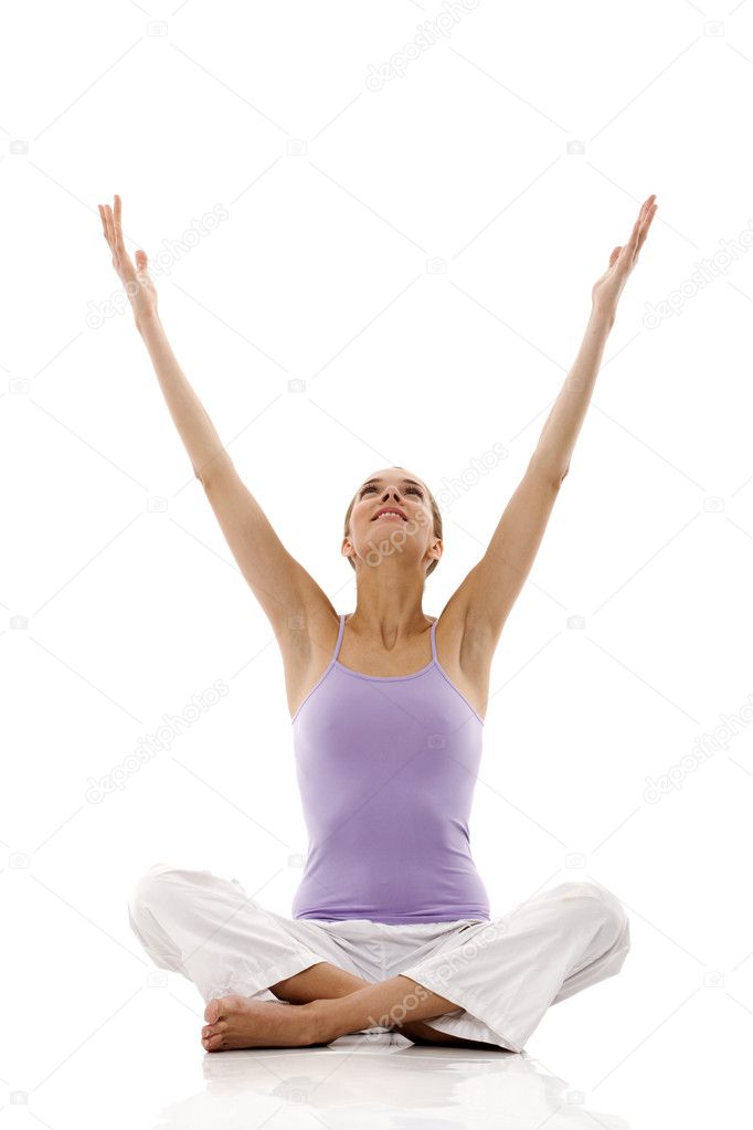 Young woman practicing yoga on white background studio