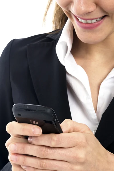 Junge Geschäftsfrau mit Handy auf weißem Hintergrund Studio — Stockfoto