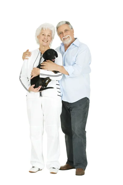 Idős házaspár egy tacskó — Stock Fotó