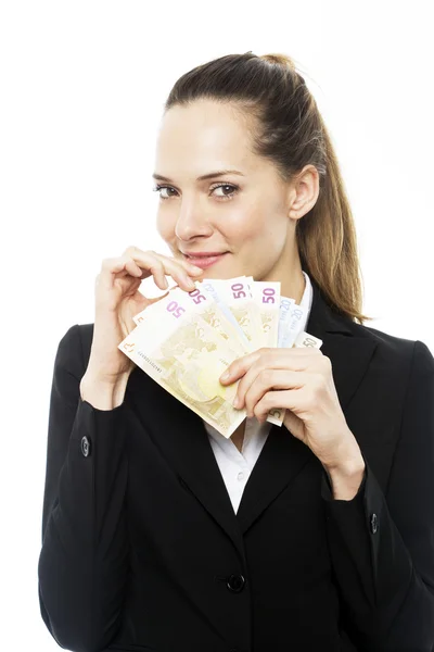 Молодая предпринимательница держит банкноты на белом фоне студии — стоковое фото