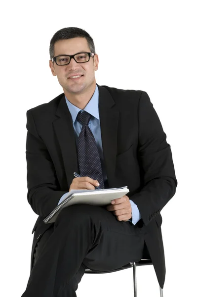 Homme d'affaires assis avec des lunettes écriture — Photo
