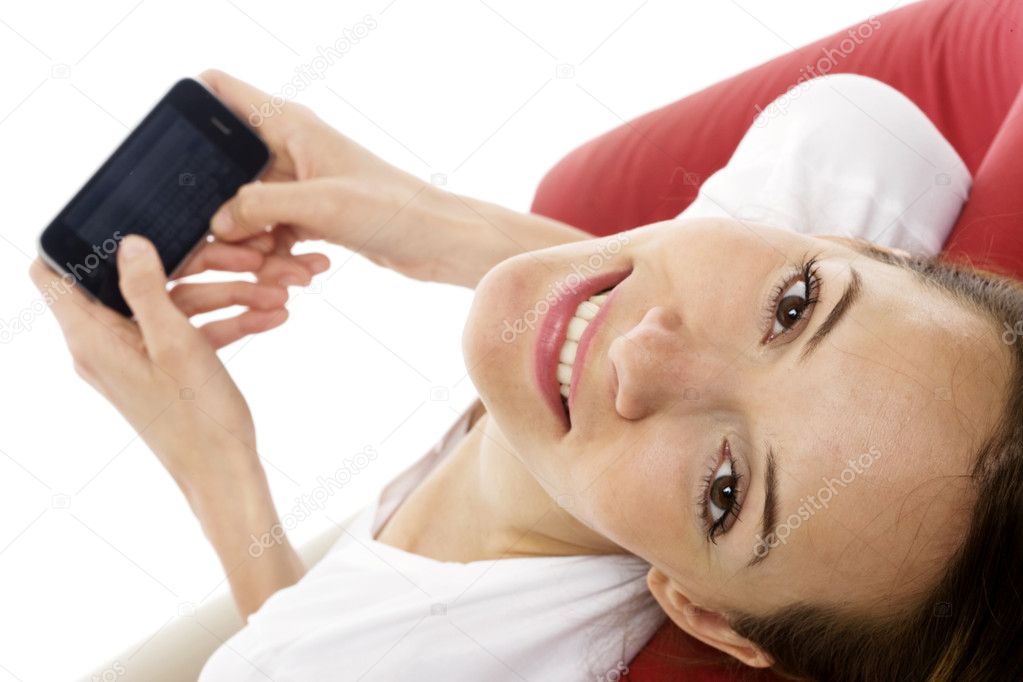 Young woman with smart phone on white background studio