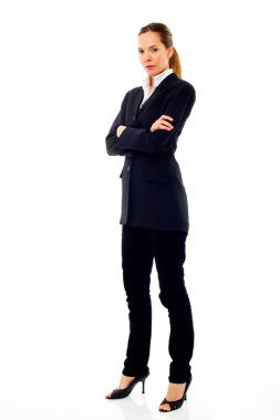 Young businesswoman standing with arms crossed clipart