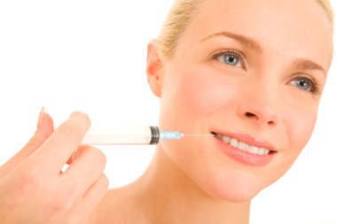 Woman with syringe of Botox clipart