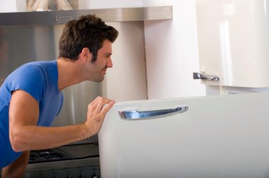 Man opening the refrigerator clipart