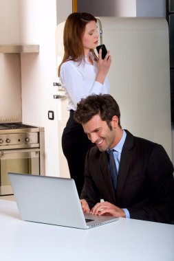 Couple at home in the kitchen clipart