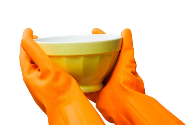 Hand with rubber glove holding a bowl — Stock Photo, Image