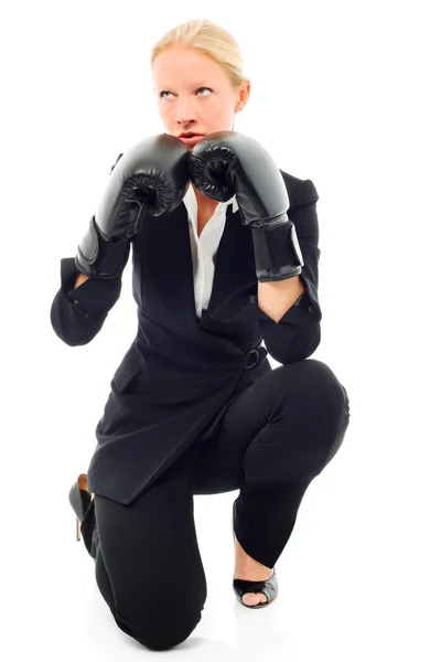 Businesswoman with aggressive air and boxing gloves — Stok fotoğraf