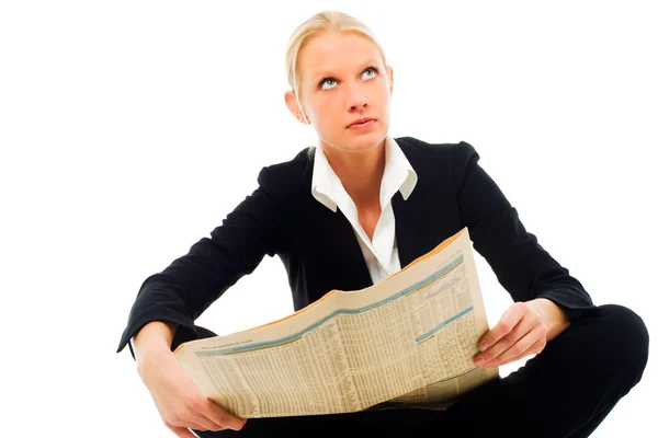 stock image Young caucasian woman wearing a black jacket sitting down and reading a new