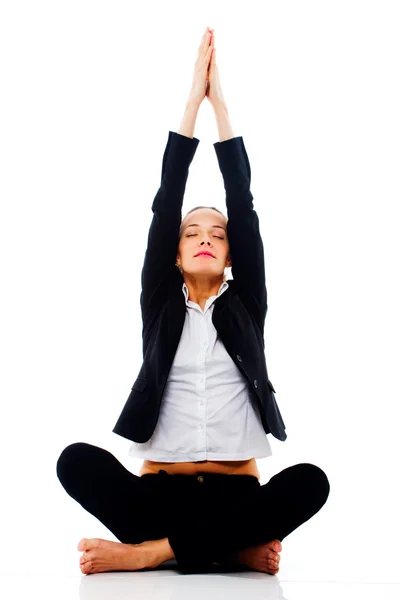 Young businesswoman doing yoga — Stock Photo, Image