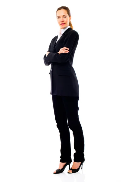 Young businesswoman standing with arms crossed — Stock Photo, Image