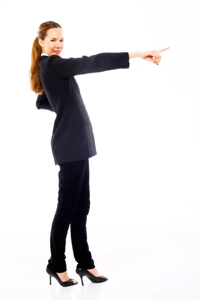 Jonge zakenvrouw permanent met haar hand die aangeeft — Stockfoto