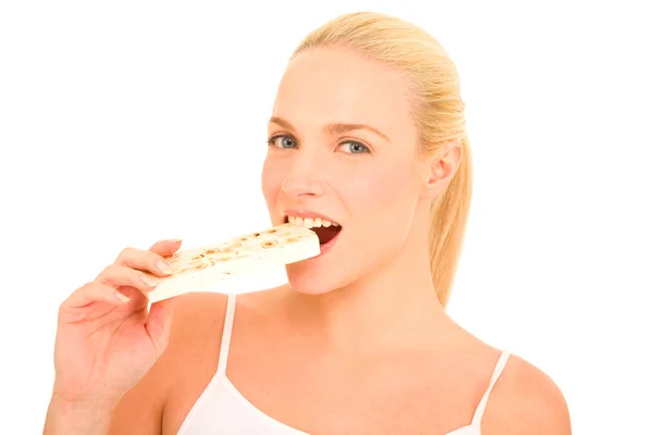 Kvinna äta nougat — Stockfoto