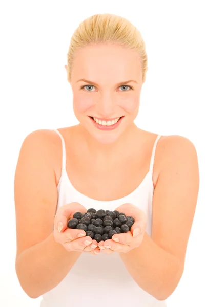 Woman with blueberries in hand — Stock Photo, Image