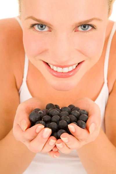 Woman with blueberries in hand — Stock Photo, Image