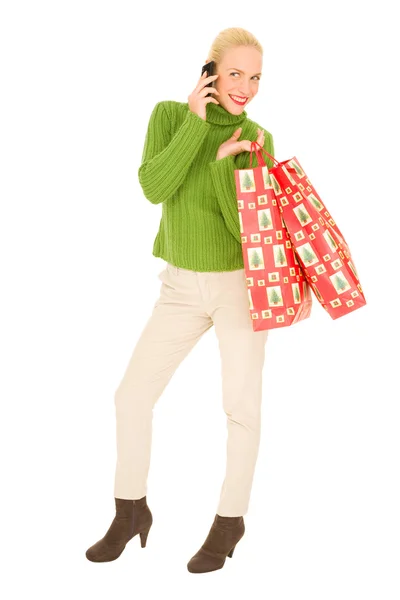 Mujer con móvil y bolsas — Foto de Stock