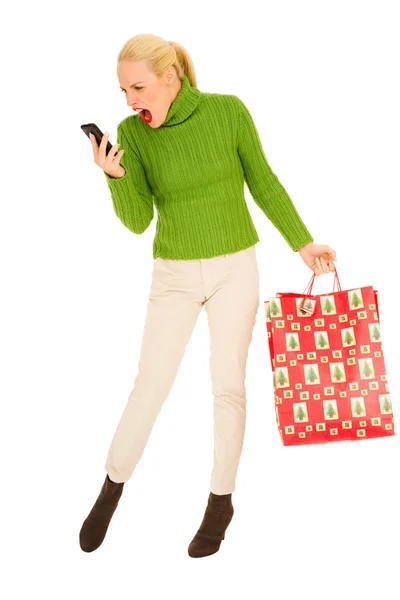 Vrouw met mobile en tassen — Stockfoto