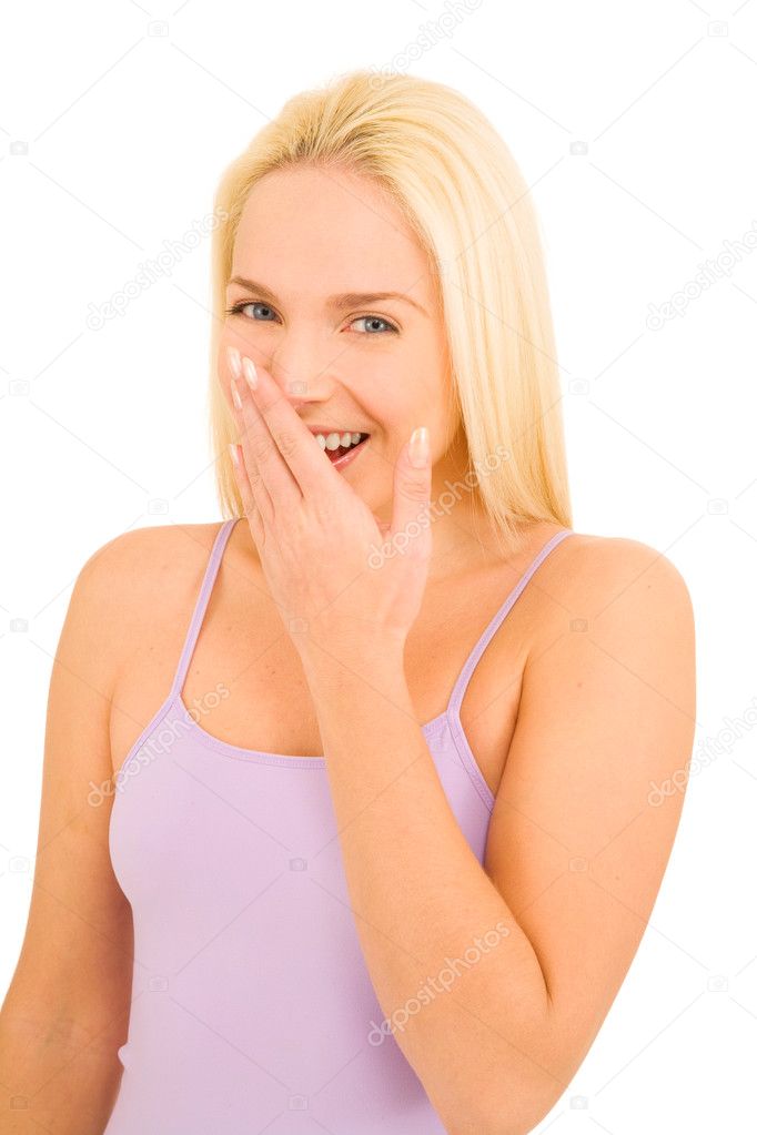 Woman laughing with hand over mouth