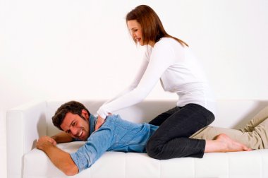 Woman massaging the shoulders of man clipart