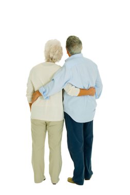 Happy elderly couple embraced from behind clipart