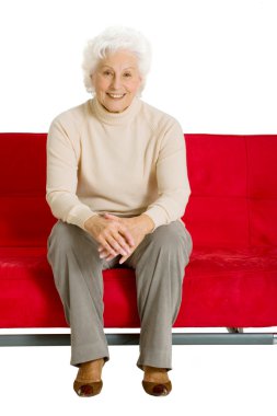 Elderly woman on the couch clipart