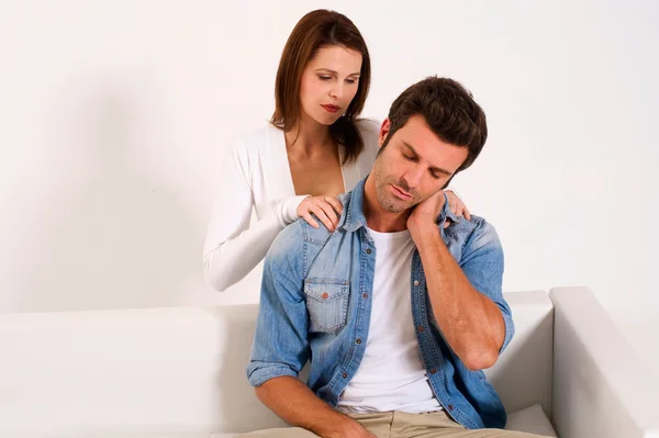 Woman massaging the shoulders of man — Stock Photo, Image