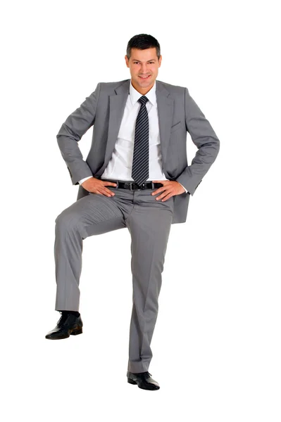 Uomo d'affari con un piede su un gradino — Foto Stock