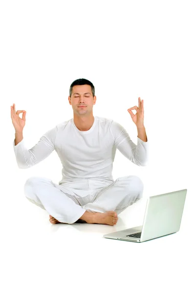 Man dressed in white sitting on the floor — Stock Photo, Image