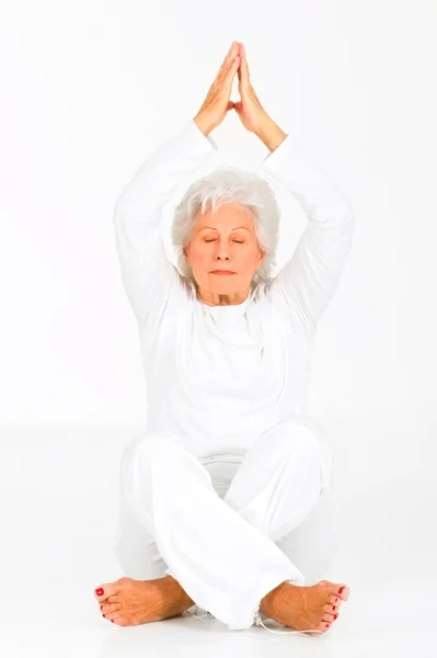 Elderly woman practicing yoga — Stock Photo, Image