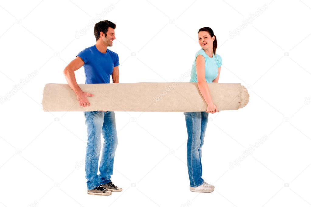 Couple carrying a carpet