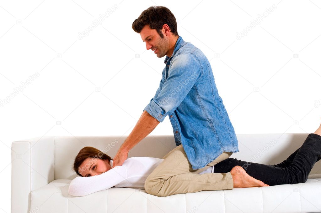 Man massaging the shoulders of a woman