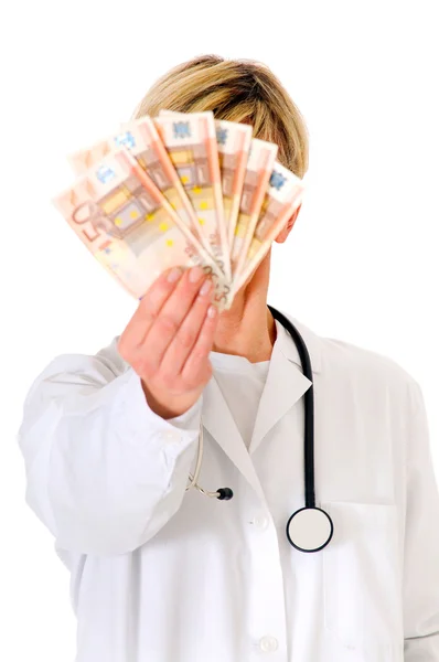 Ärztin mit Geldscheinen — Stockfoto