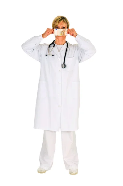 Female doctor holding banknotes — Stock Photo, Image