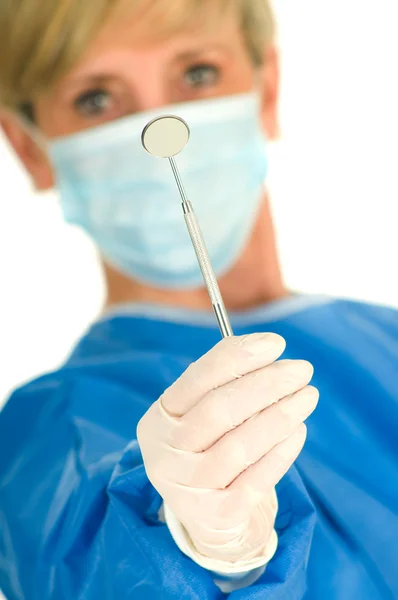 Dentist holding dental mirror — Stock Photo, Image