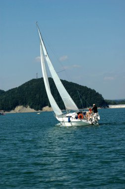 Sailing on Solina Lake, Poland clipart