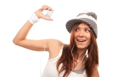 Woman listening music in headphones clipart