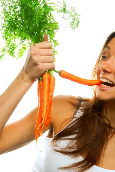 Woman holding bunch of carrots — Stock Photo, Image