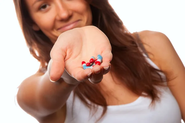 Young Woman Doctor Offering Pill Capsules Red Blue Patient Hand — Stock Fotó