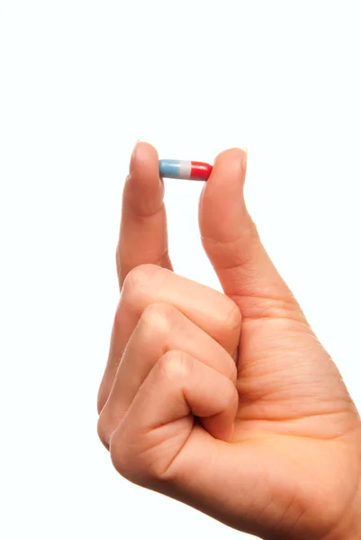 Píldora analgésica en la mano — Foto de Stock
