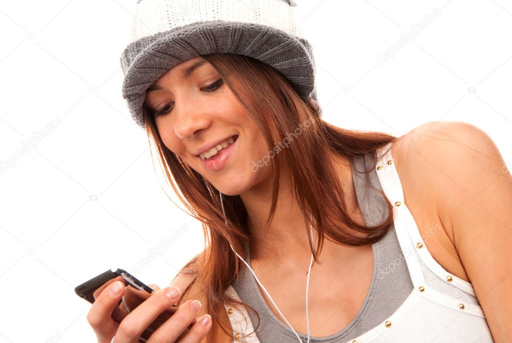 Teenage girl typing and reading text message on cell phone