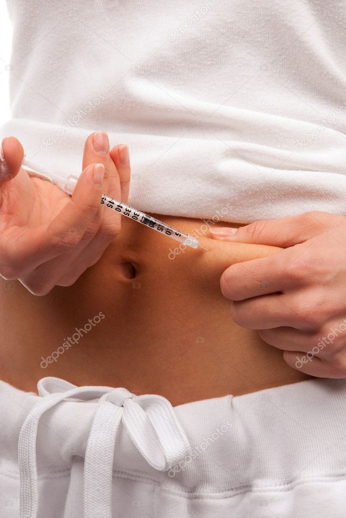 Diabetes patient making insulin injection by single use syringe shot in subcutaneous abdomen muscle with dose of humalog isolated on white background