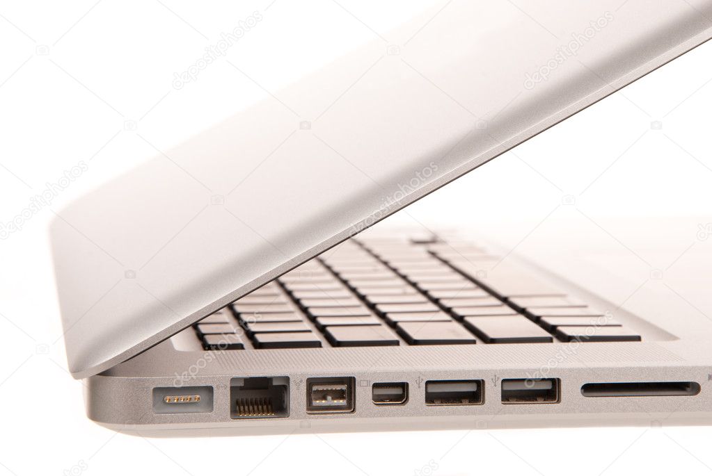 Side view of modern laptop computer with usb, MagSafe power, Gigabit Ethernet port, One FireWire 800, SD card slot isolated on white