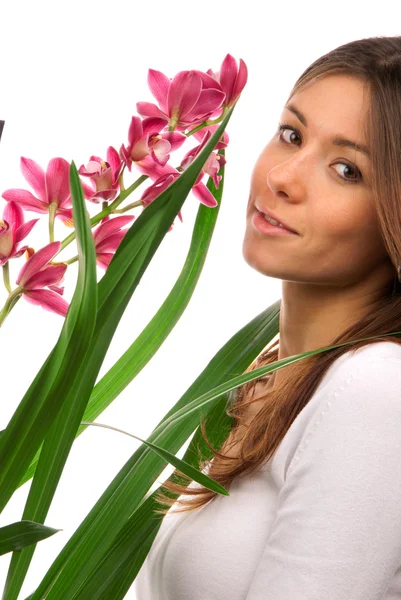 Pretty Brunette Woman Smelling Natural Purple Orchid Flower Looking Camera — Stock Photo, Image