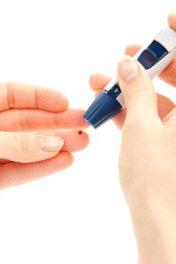 Diabetic lancet in hand prick finger to make punctures to obtain small blood specimens for blood glucose, hemoglobin level test using glucometer isolated on a w clipart