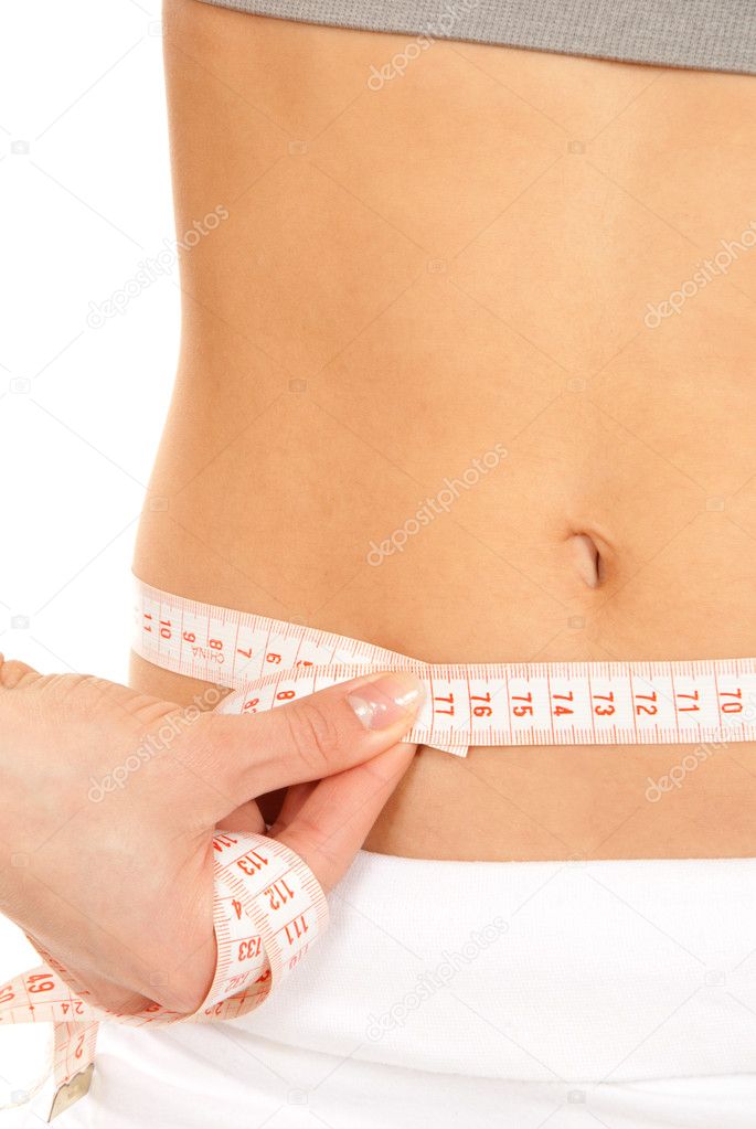 Athletic fit slim female measuring waist Stock Photo by ©dml5050 5280347