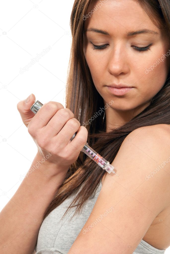 Woman making insulin flu shot by syringe pen