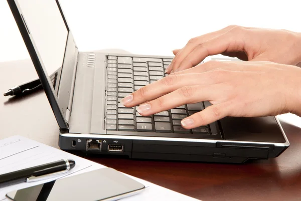 Hands typing on laptop computer keyboard — Stock Photo, Image