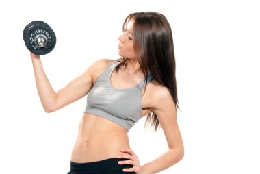 Fitness woman working out dumbbells in gym clipart