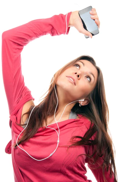 Прекрасная девочка слушает музыку в наушниках — стоковое фото